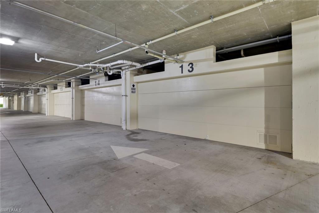 21450 Strada Nuova Circle, Unit A301 Estero, FL 33928 - Photo 26 of 40 a view of a garage