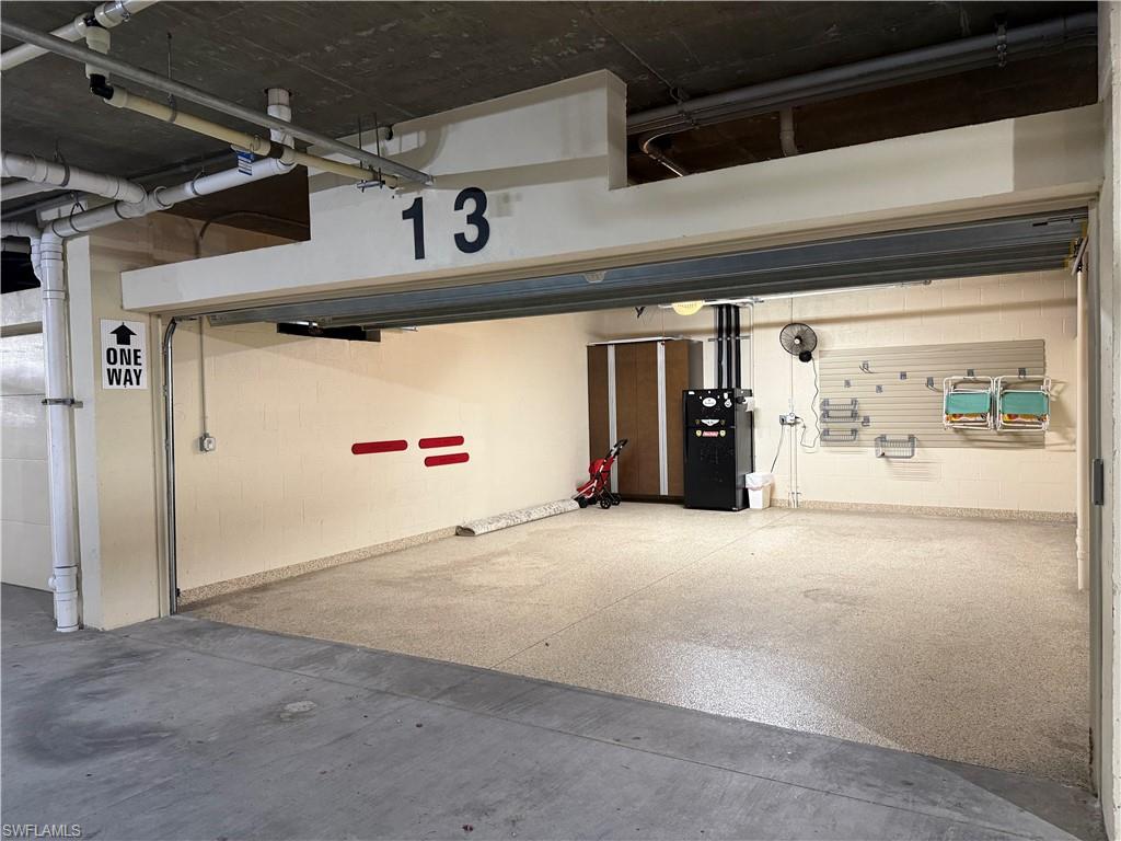 21450 Strada Nuova Circle, Unit A301 Estero, FL 33928 - Photo 27 of 40 a view of parking garage