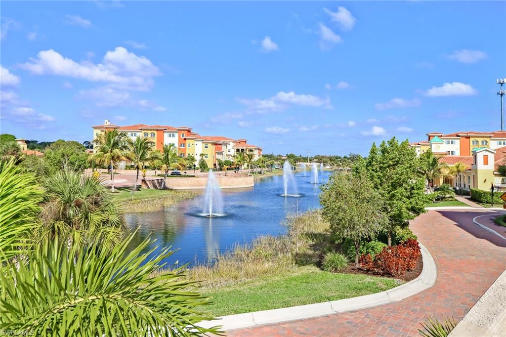 21450 Strada Nuova Circle, Unit A301 Estero, FL 33928 - Photo 31 of 40 a view of a water pond with an outdoor space