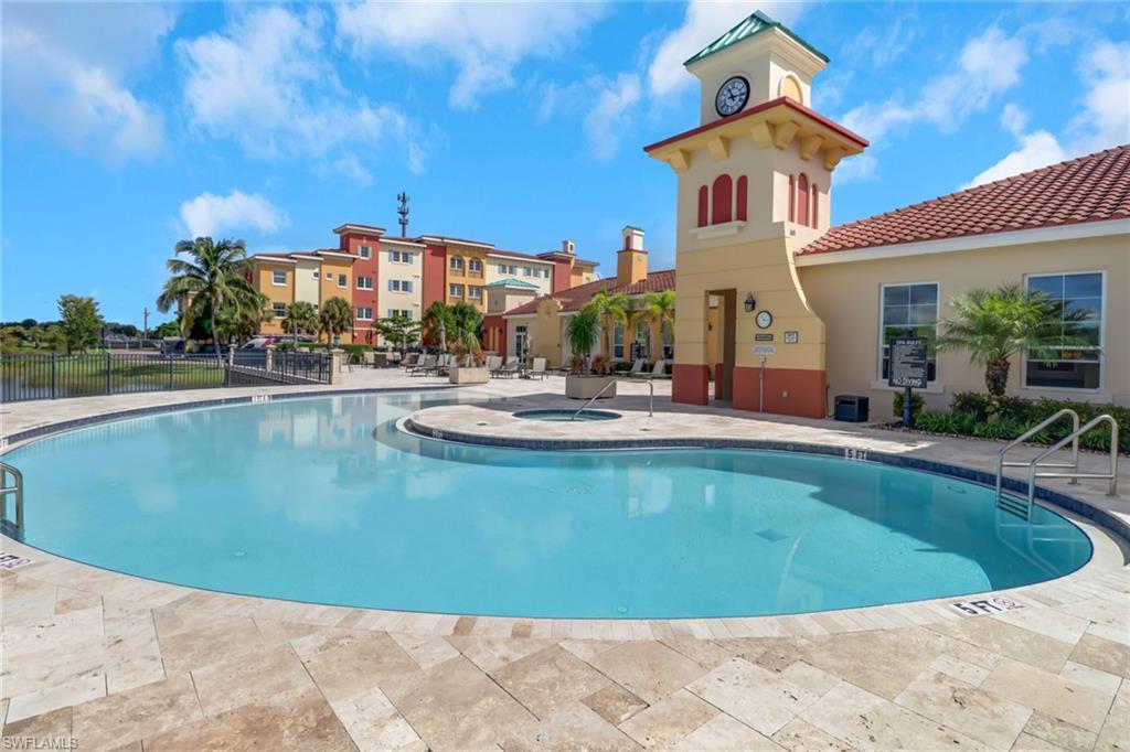 21450 Strada Nuova Circle, Unit A301 Estero, FL 33928 - Photo 32 of 40 a view of a house with swimming pool