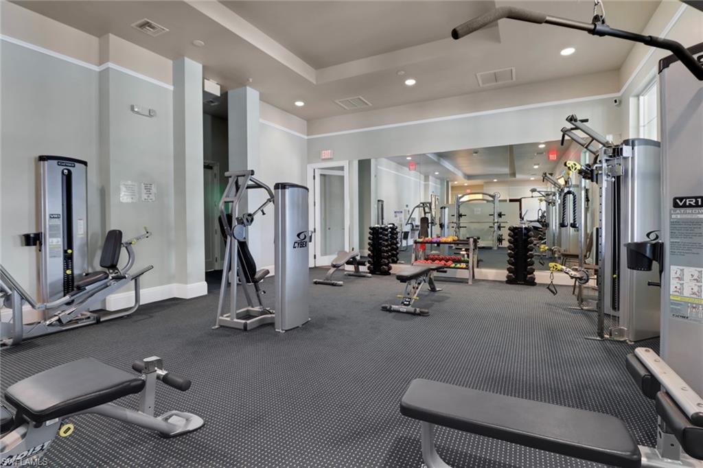 21450 Strada Nuova Circle, Unit A301 Estero, FL 33928 - Photo 37 of 40 a view of a room with gym equipment