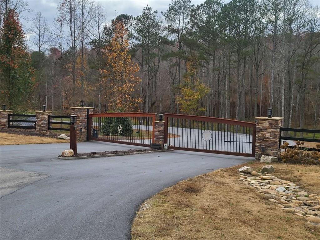 0 Canoe Way Talking Rock, GA 30175 - Photo 7 of 18 a view of a street with wooden fence