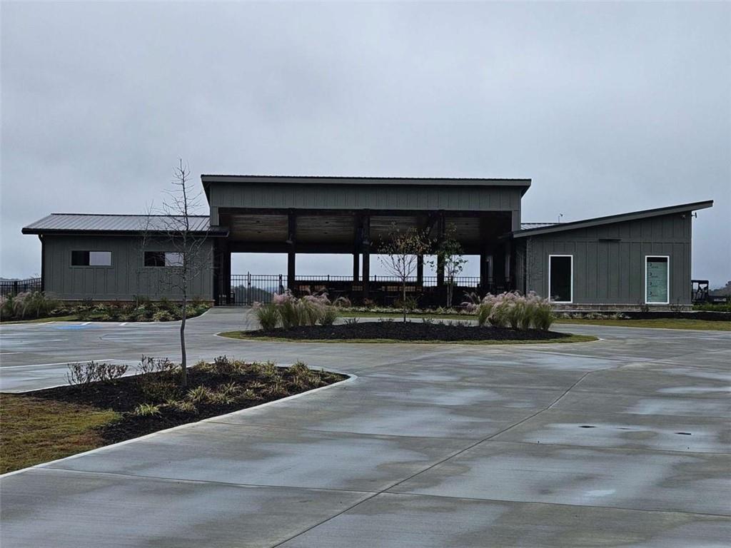 0 Canoe Way Talking Rock, GA 30175 - Photo 10 of 18 a view of a house with a small yard and wooden fence