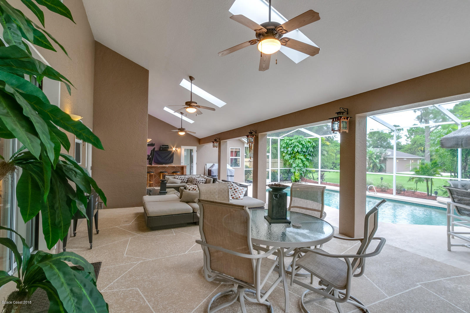 4247 Turtle Mound Road Melbourne, FL 32934 - Photo 14 of 74 a living room with patio furniture and a potted plant