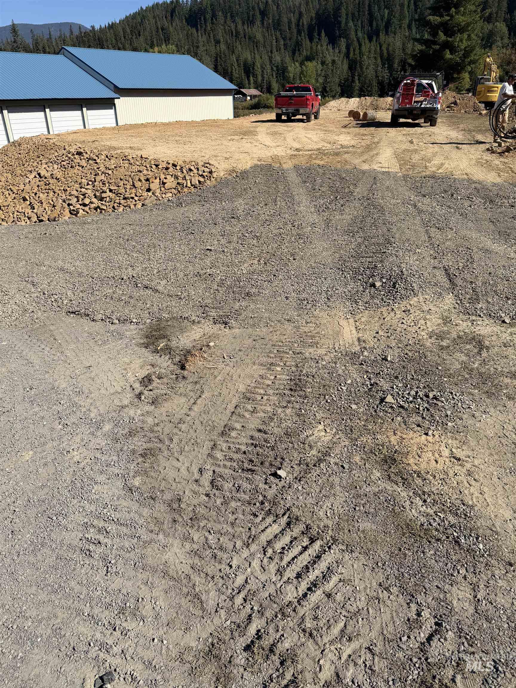 Tbd Dent Bridge Road Elk River, ID 83827 - Photo 14 of 23 View of yard with a wooded view, an outdoor structure, and a pole building