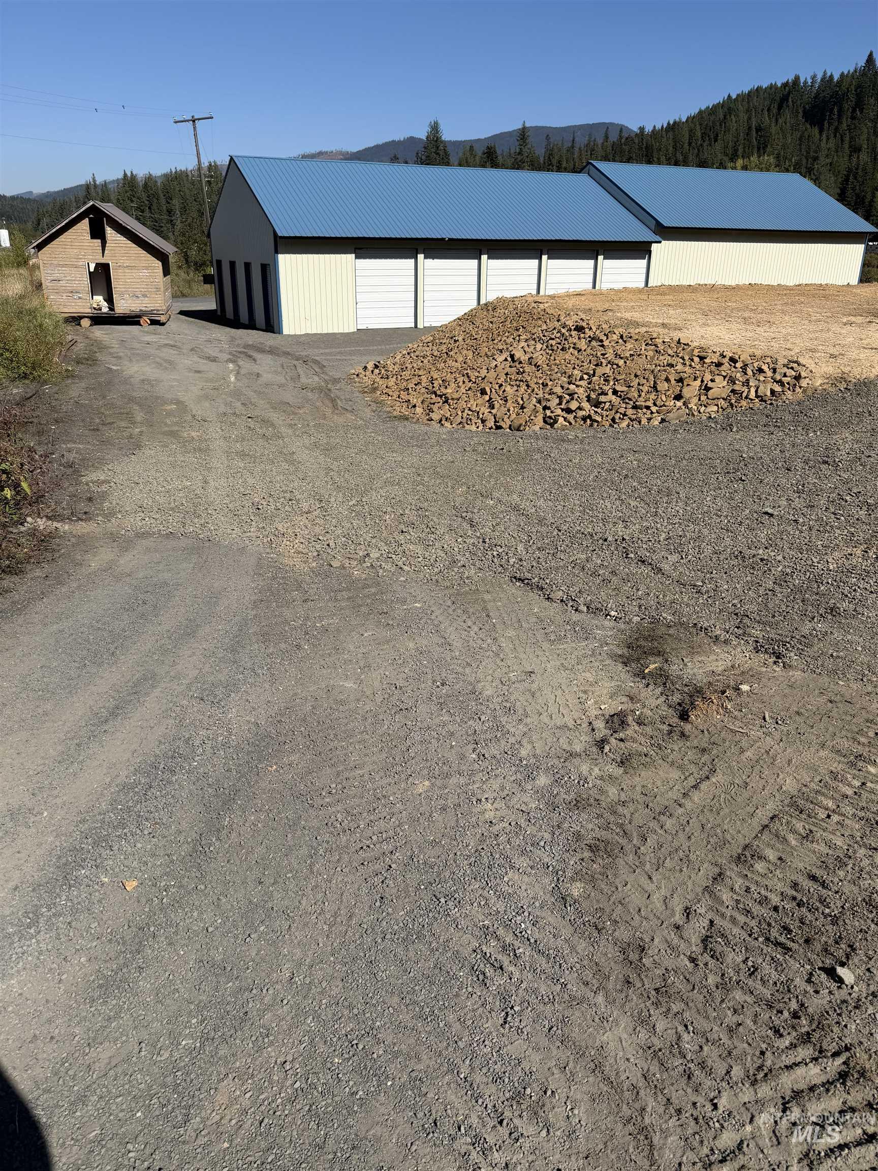 Tbd Dent Bridge Road Elk River, ID 83827 - Photo 15 of 23 View of dirt / gravel driveway featuring a pole building and a wooded view