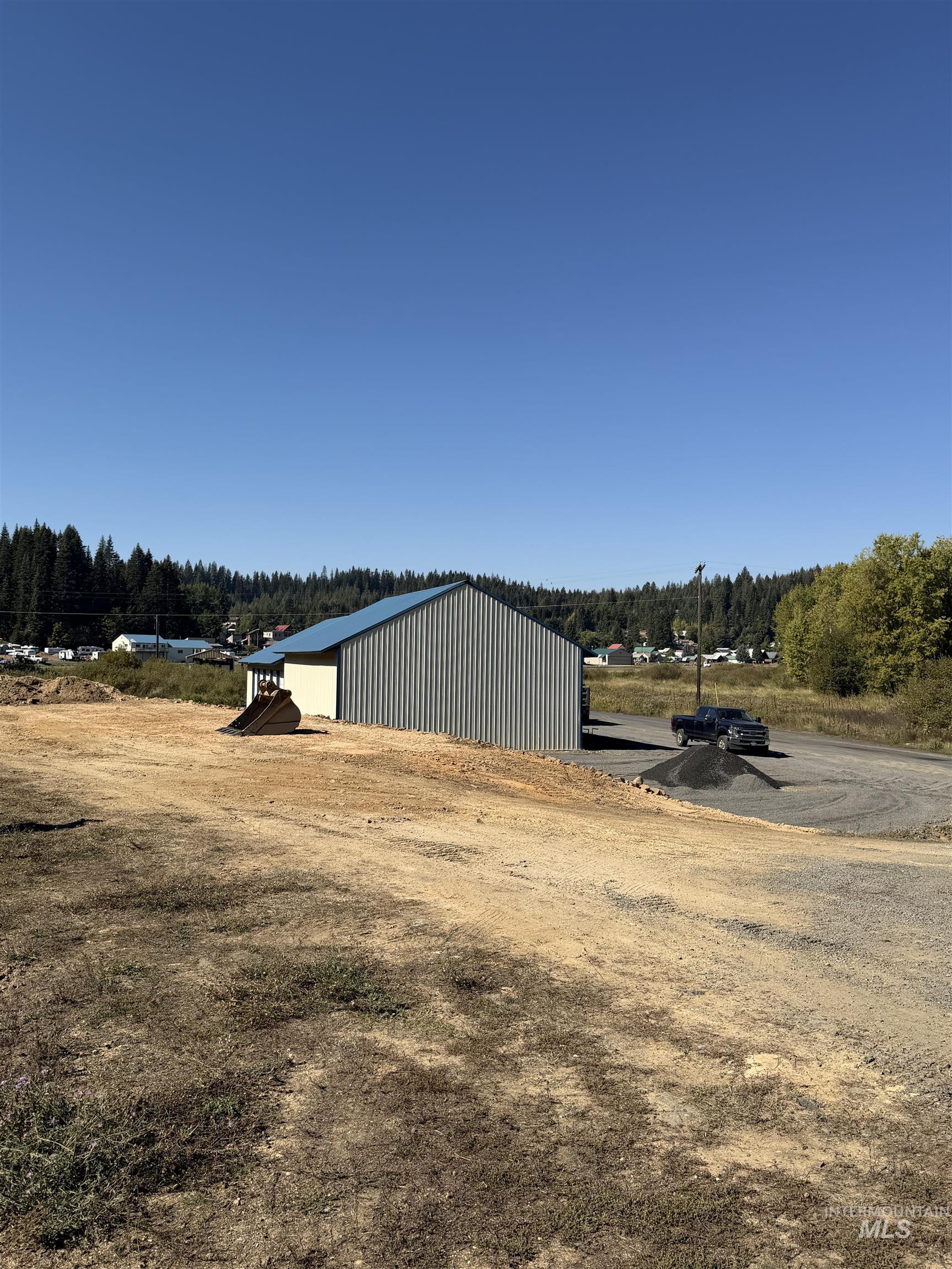 Tbd Dent Bridge Road Elk River, ID 83827 - Photo 5 of 23 View of yard with a pole building, an outbuilding, and a wooded view