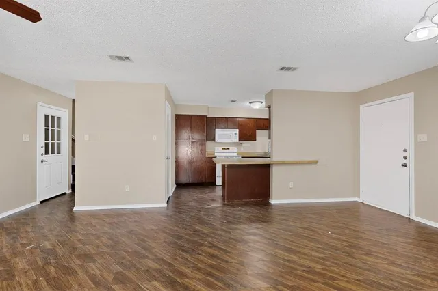 a view of kitchen with wooden floor