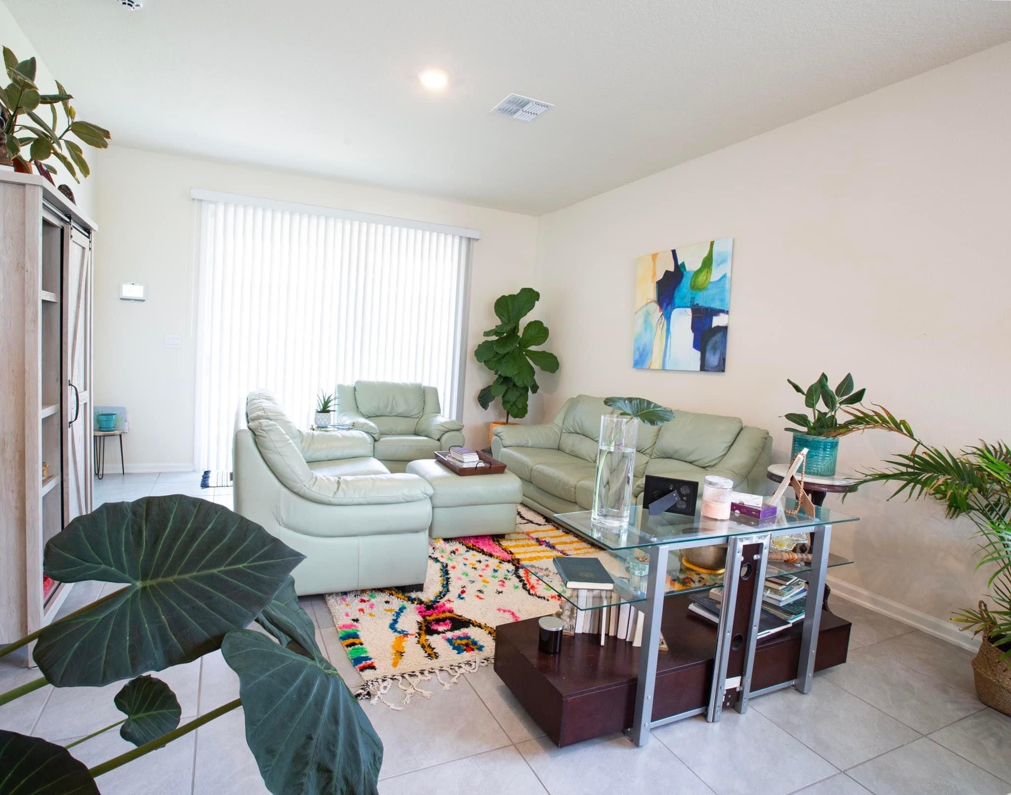 55 Crooked Branch Way Street St. Augustine, FL 32084 - Photo 3 of 11 a living room with furniture and a potted plant