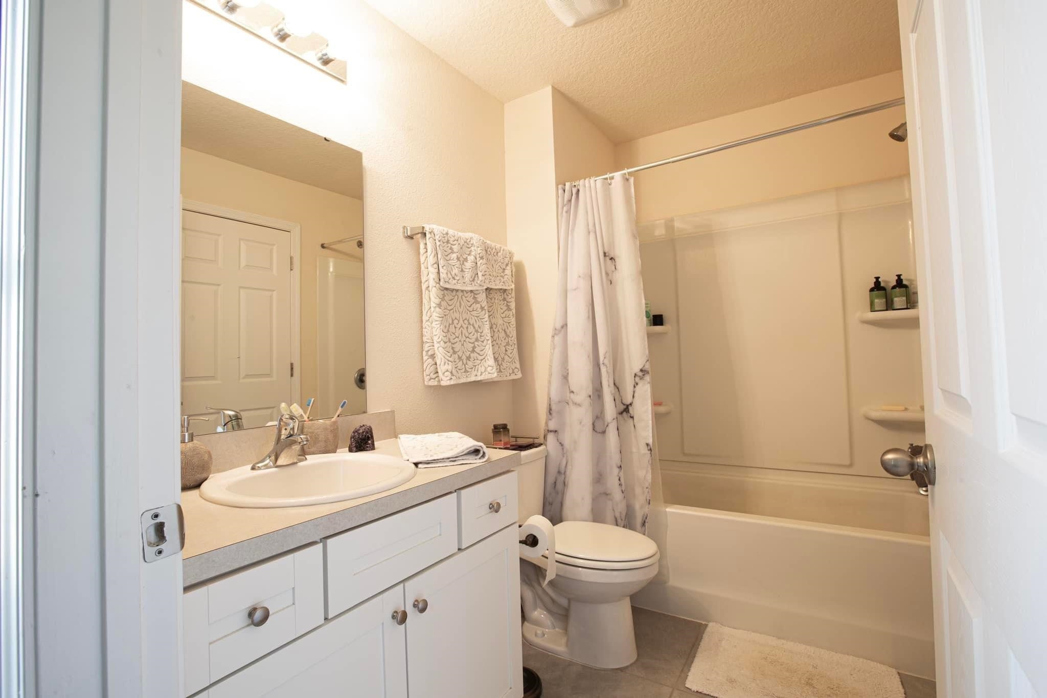 55 Crooked Branch Way Street St. Augustine, FL 32084 - Photo 7 of 11 a bathroom with a sink a toilet and shower