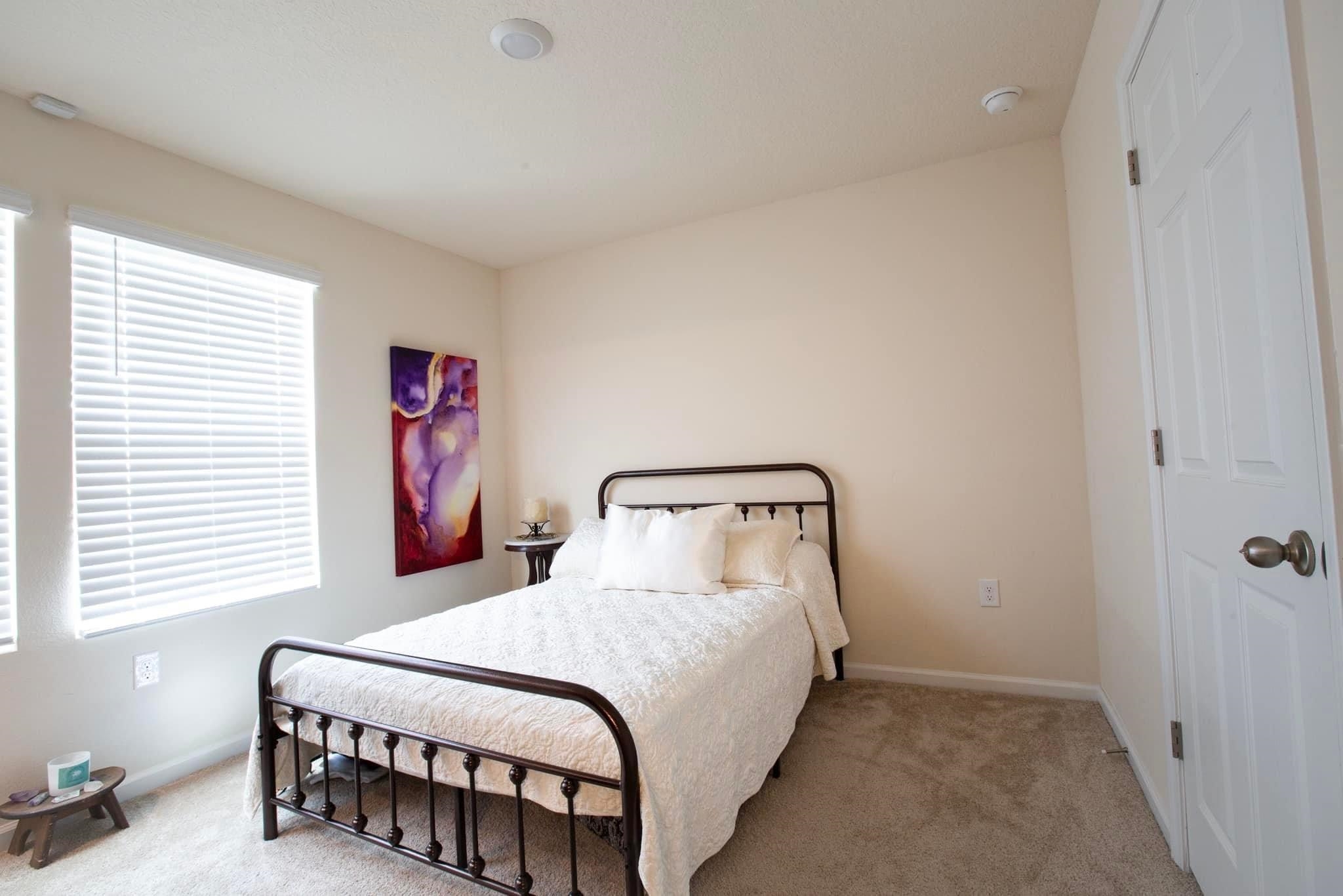 55 Crooked Branch Way Street St. Augustine, FL 32084 - Photo 10 of 11 a bedroom with a bed and a window