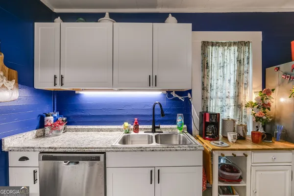 a kitchen with stainless steel appliances a refrigerator and a stove