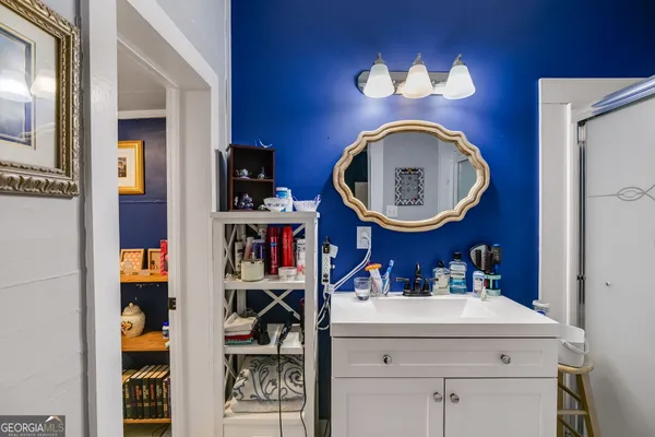 a white bath tub sitting next to a white toilet