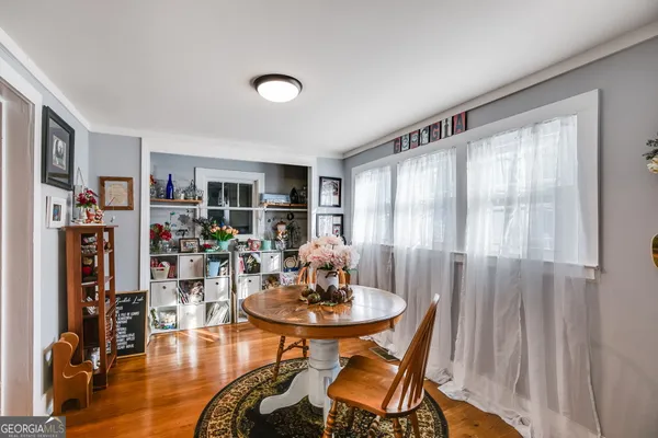 a view of a livingroom with furniture and a table