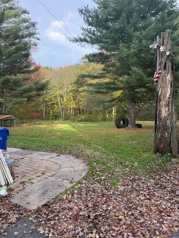 a view of a field with sitting area