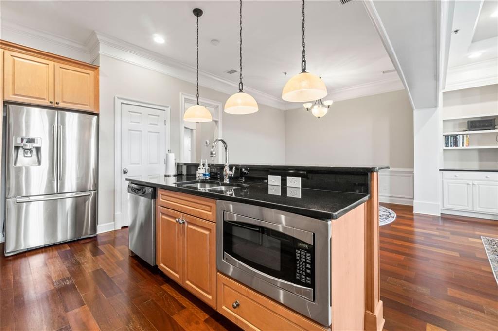 3 Buford Village Way Buford, GA 30518 - Photo 17 of 40 a kitchen with stove and wooden floor
