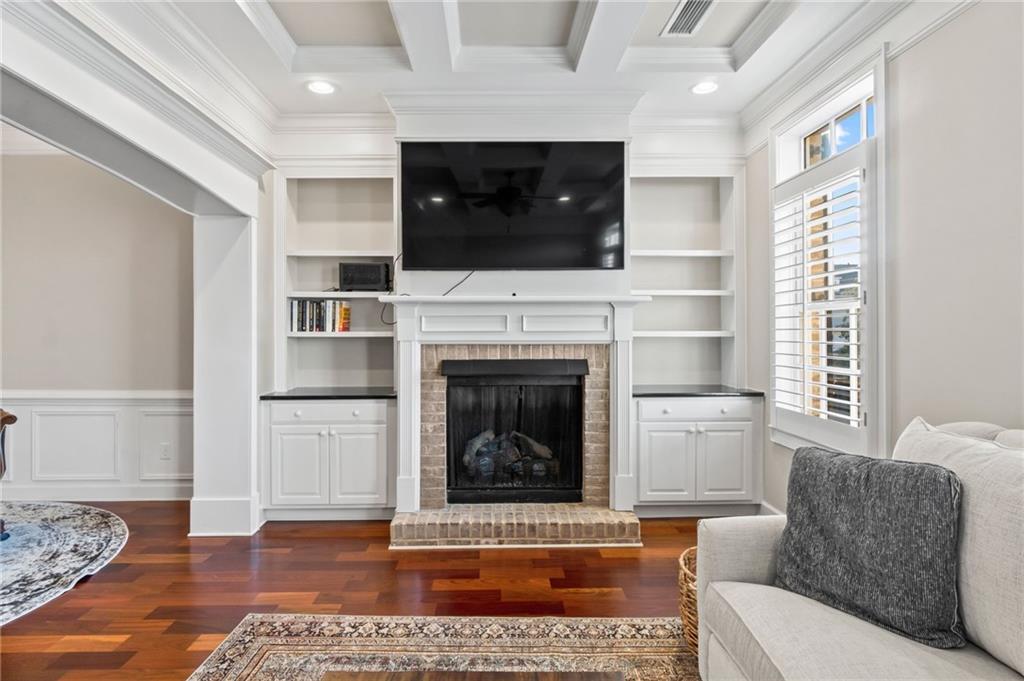 3 Buford Village Way Buford, GA 30518 - Photo 20 of 40 a living room with furniture and a fireplace