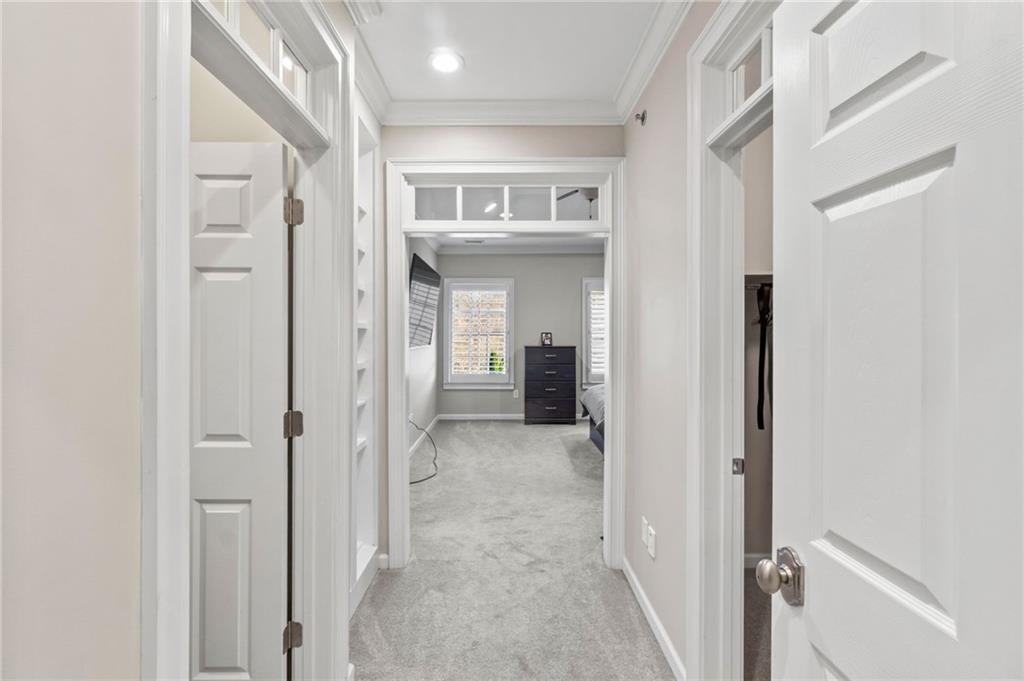 3 Buford Village Way Buford, GA 30518 - Photo 23 of 40 a view of a hallway with a livingroom and a bathroom