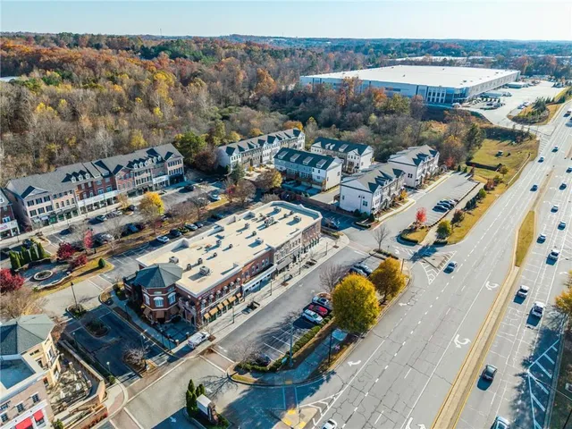 an aerial view of a house with a lake view