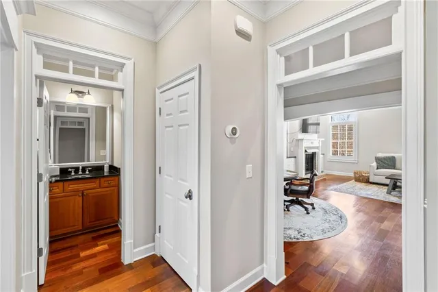 a view of a kitchen with kitchen island granite countertop a sink and a stove top oven