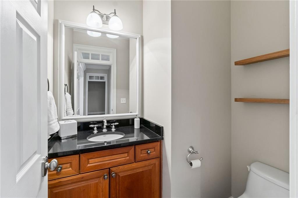 3 Buford Village Way Buford, GA 30518 - Photo 10 of 40 a bathroom with a granite countertop sink and a mirror