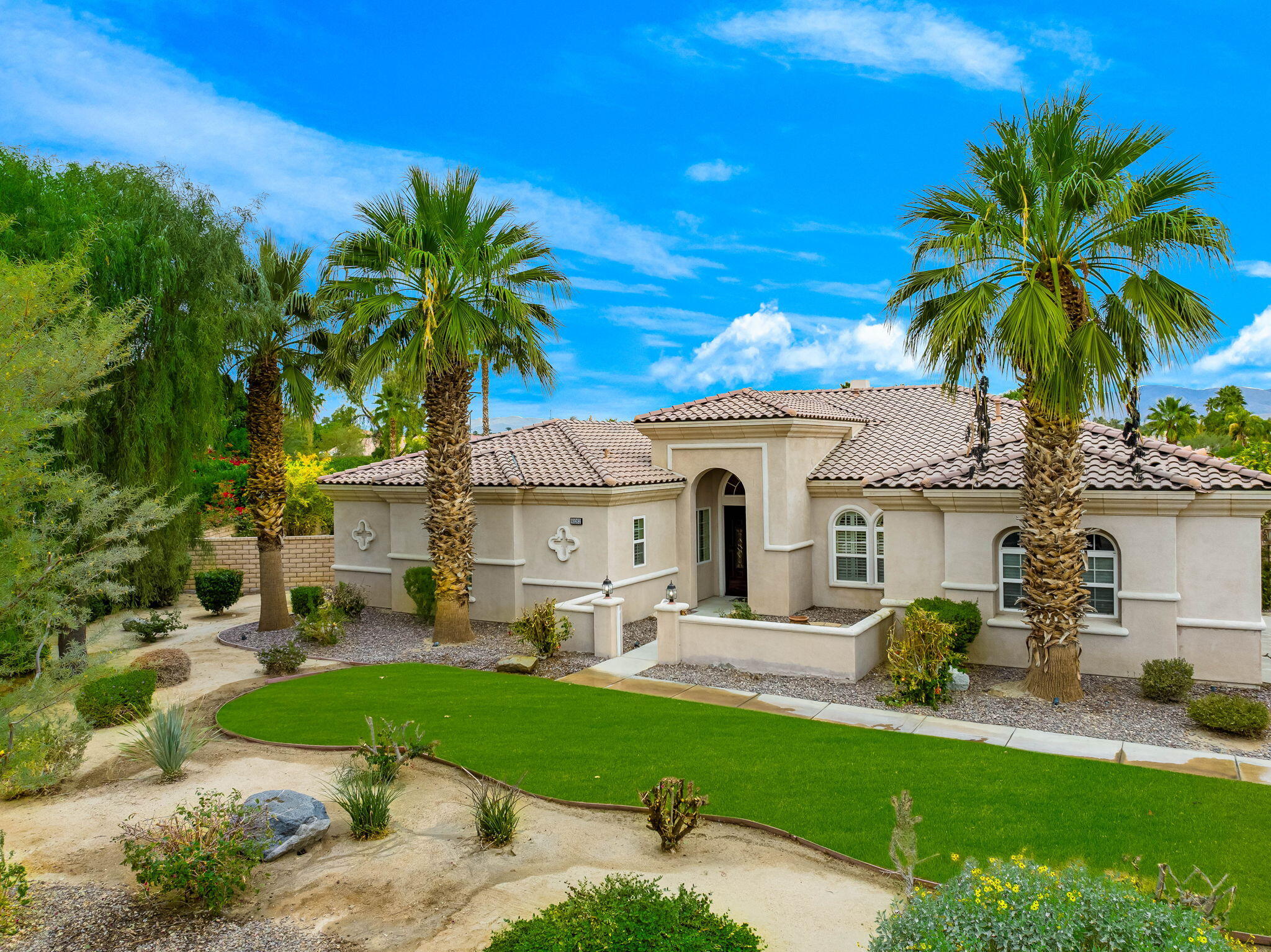 a front view of house with yard and outdoor seating