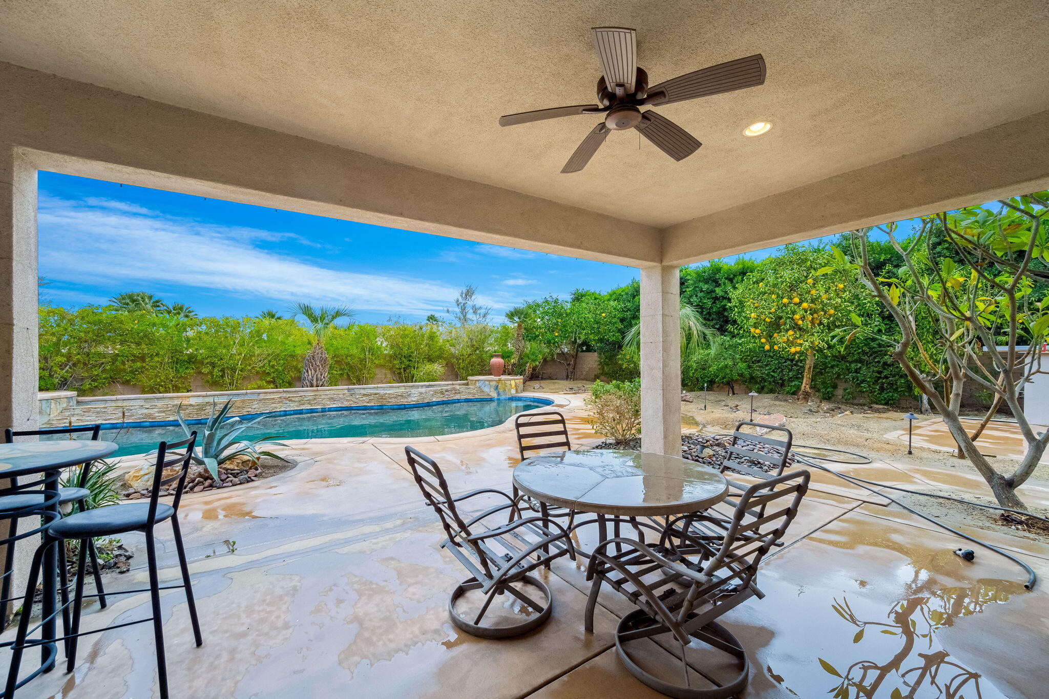 80262 Amazon Indio, CA 92201 - Photo 13 of 45 a view of a patio with a dining table and chairs