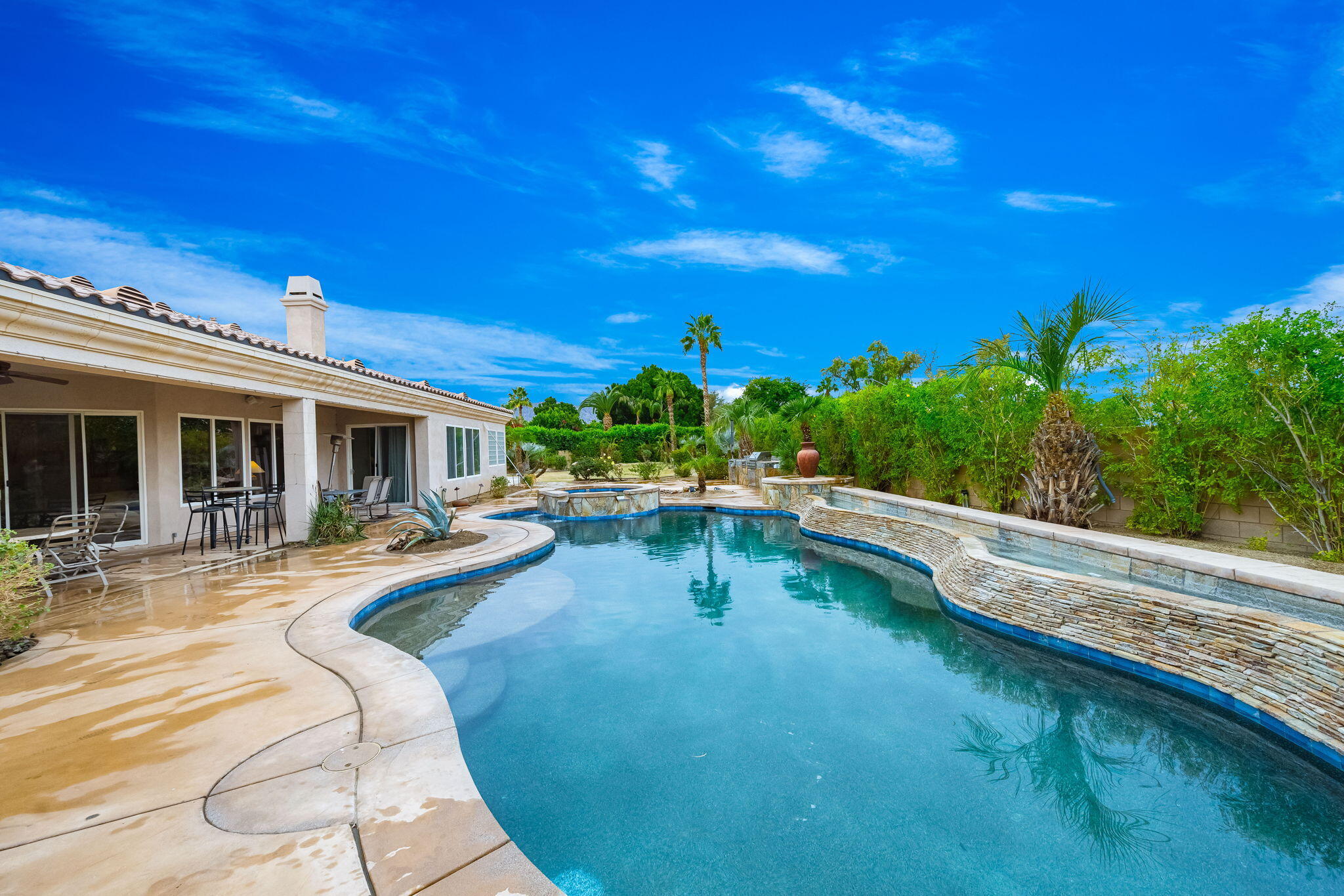 80262 Amazon Indio, CA 92201 - Photo 15 of 45 a swimming pool with outdoor seating and yard