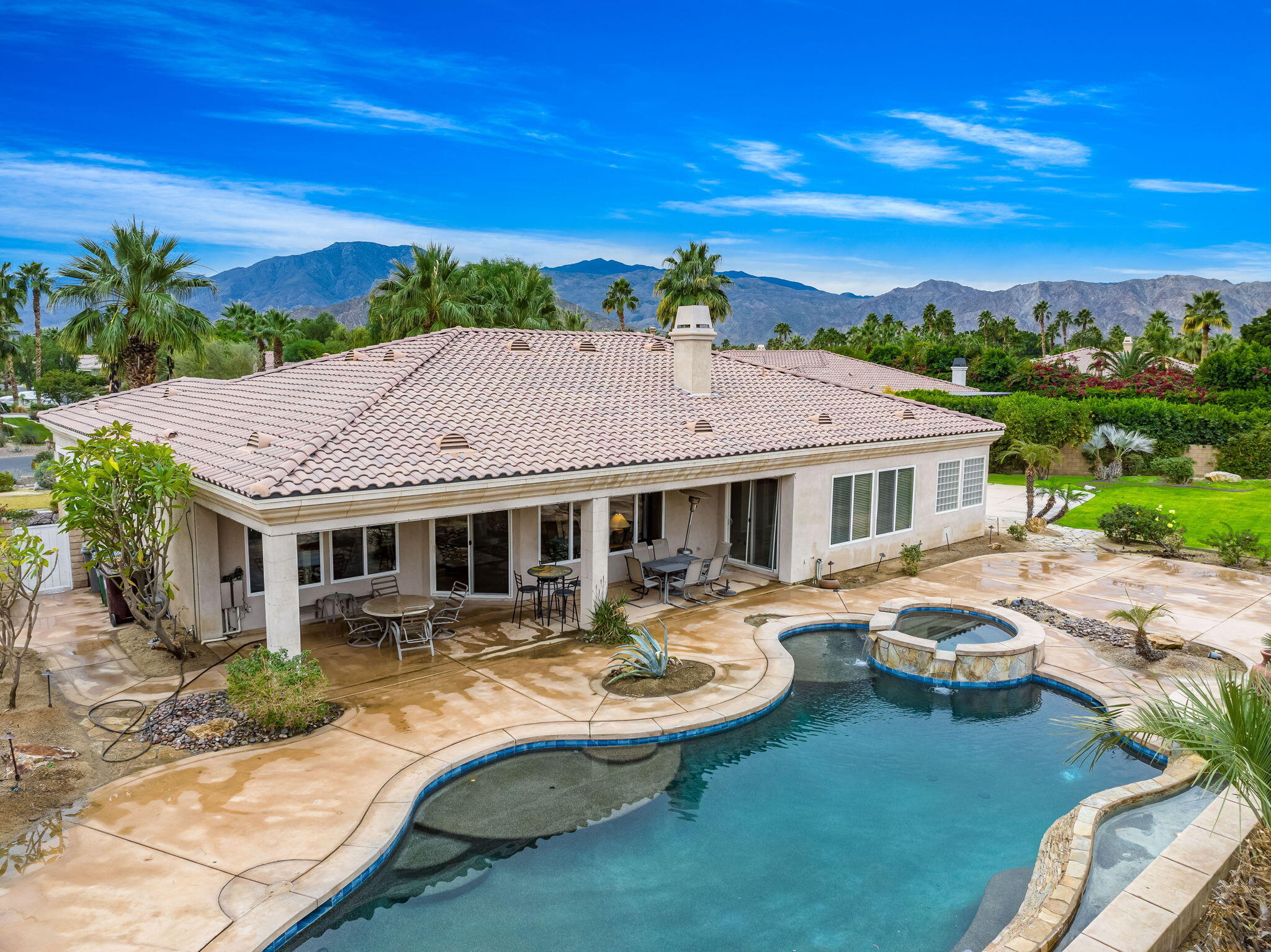 80262 Amazon Indio, CA 92201 - Photo 2 of 45 a view of a patio with couches chairs and potted plants