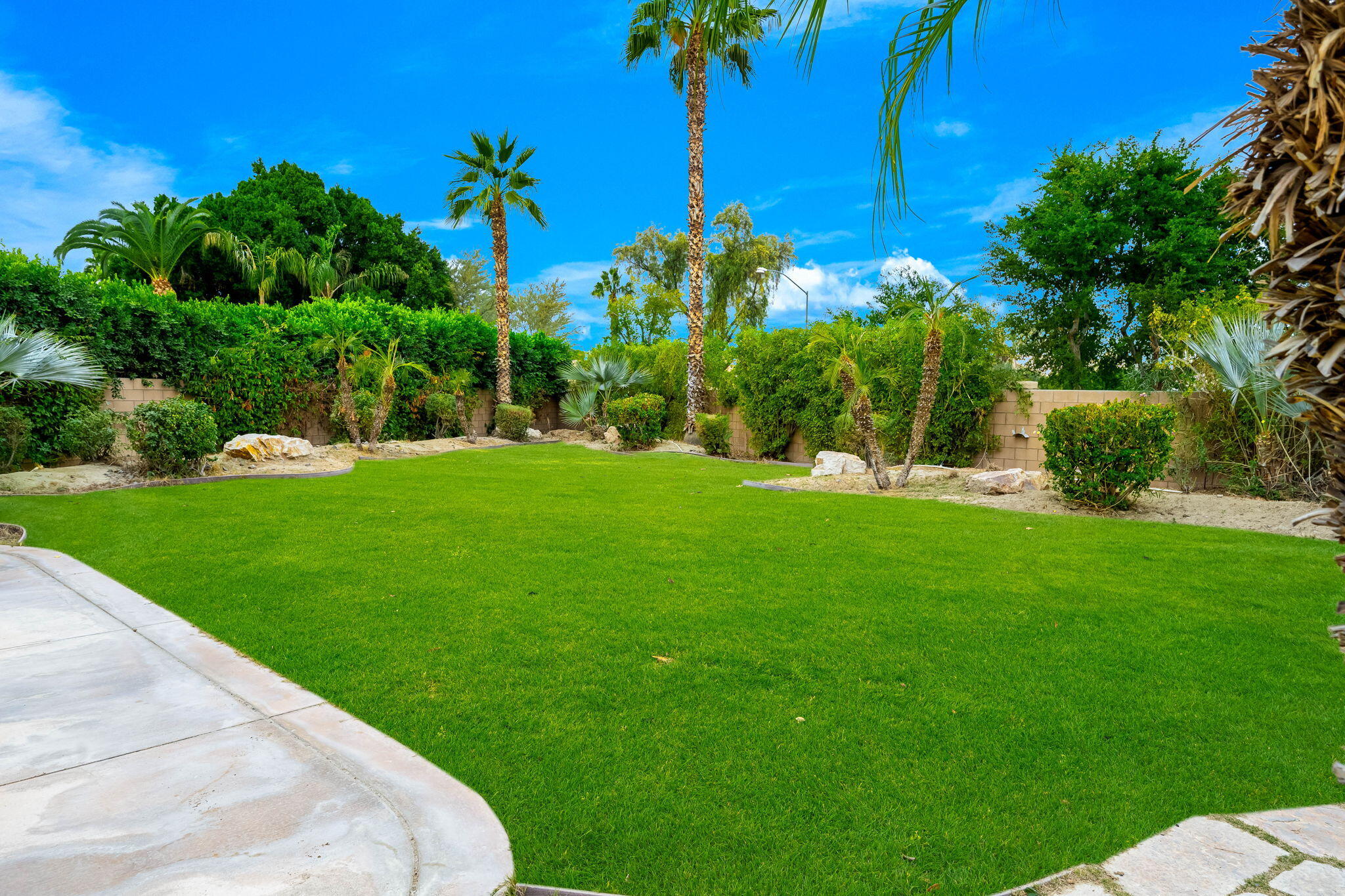 80262 Amazon Indio, CA 92201 - Photo 21 of 45 a view of a backyard with a garden