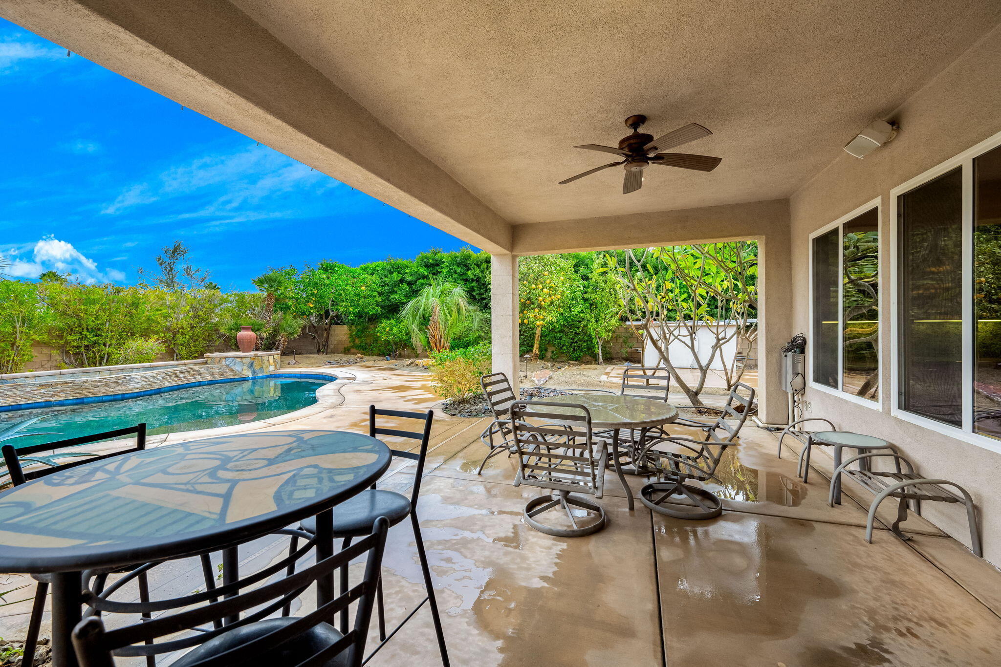 80262 Amazon Indio, CA 92201 - Photo 24 of 45 a view of a patio with a dining table and chairs