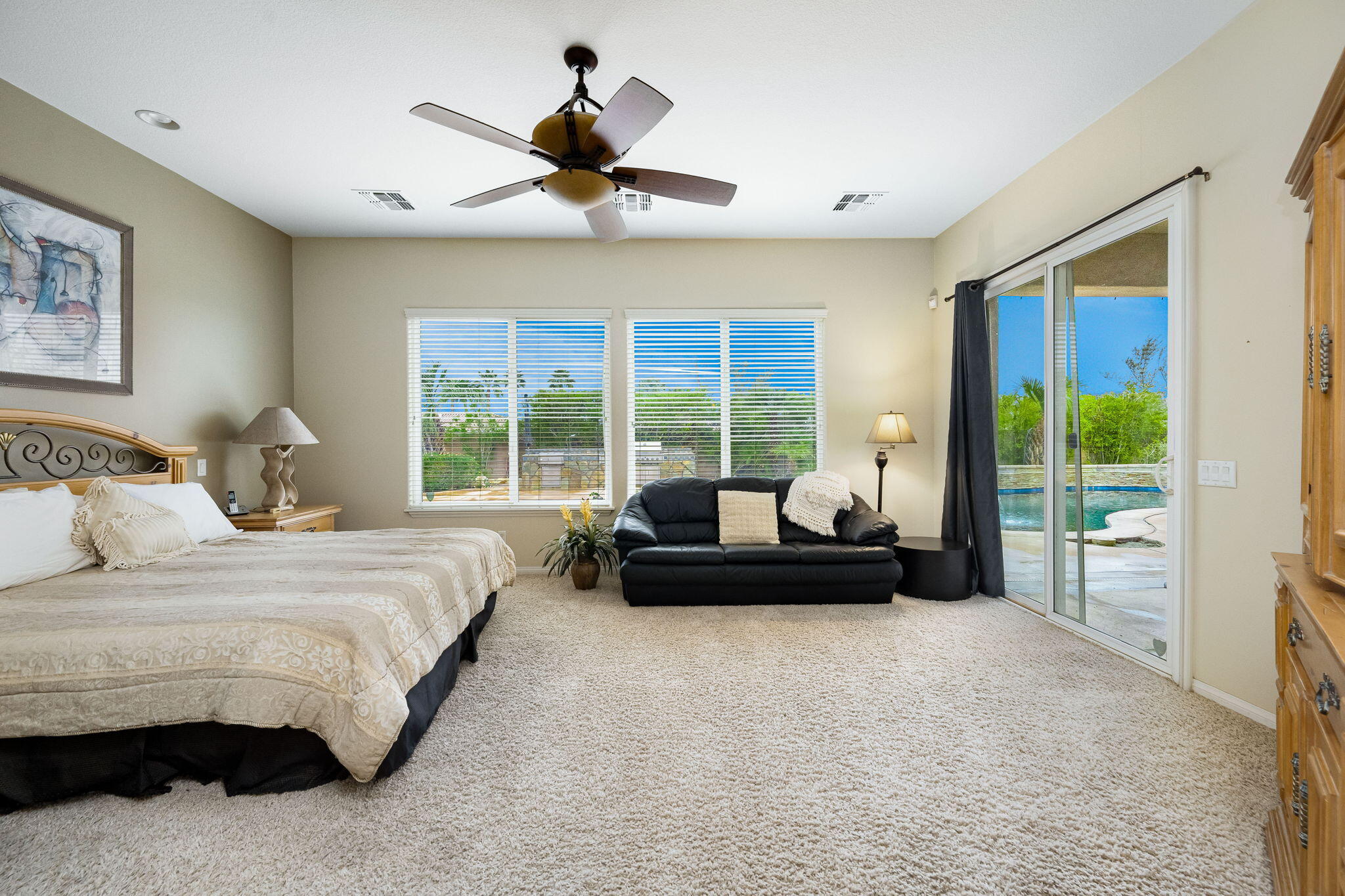 80262 Amazon Indio, CA 92201 - Photo 33 of 45 a bedroom with a bed and a couch