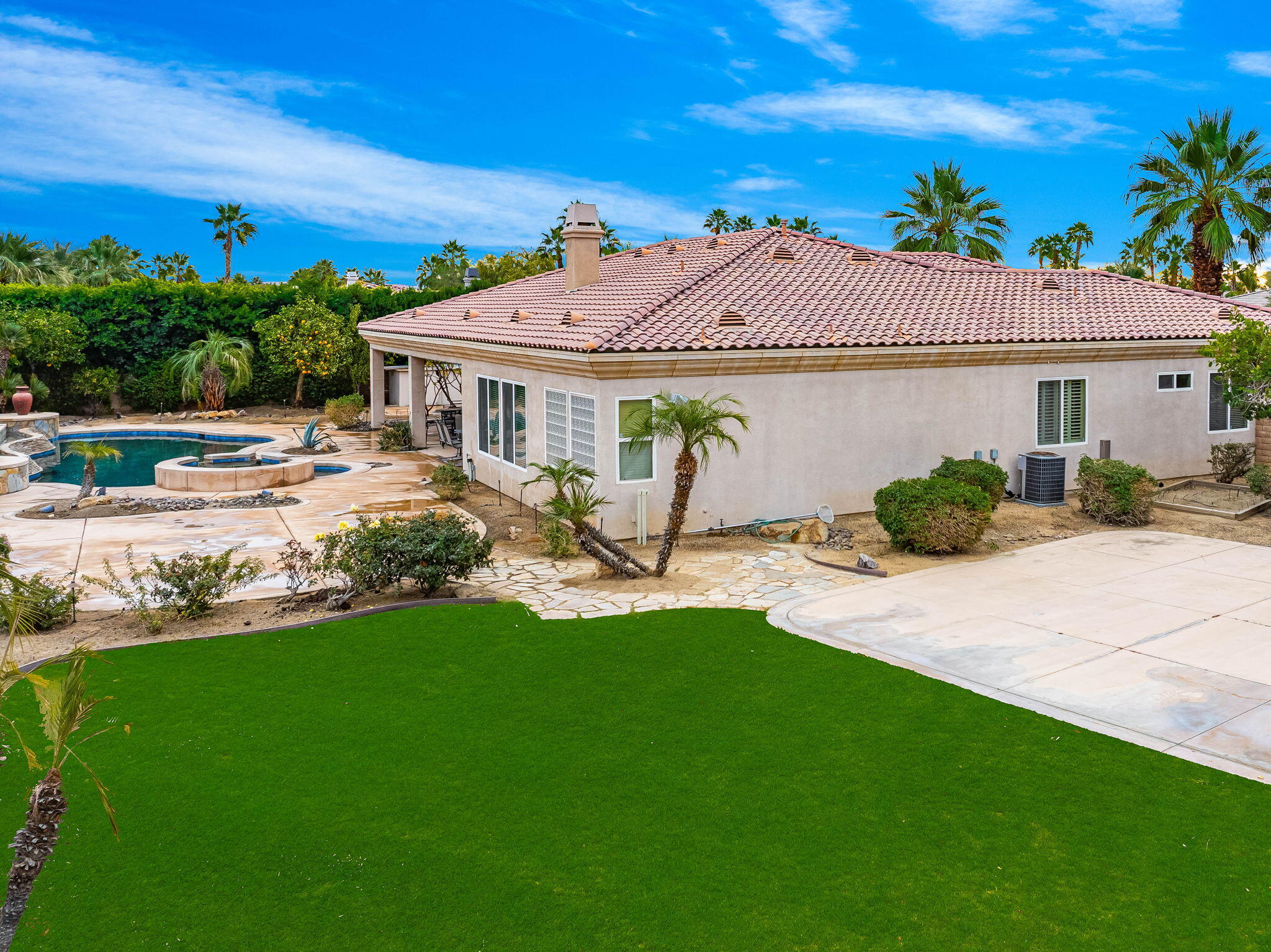 80262 Amazon Indio, CA 92201 - Photo 5 of 45 a front view of a house with garden