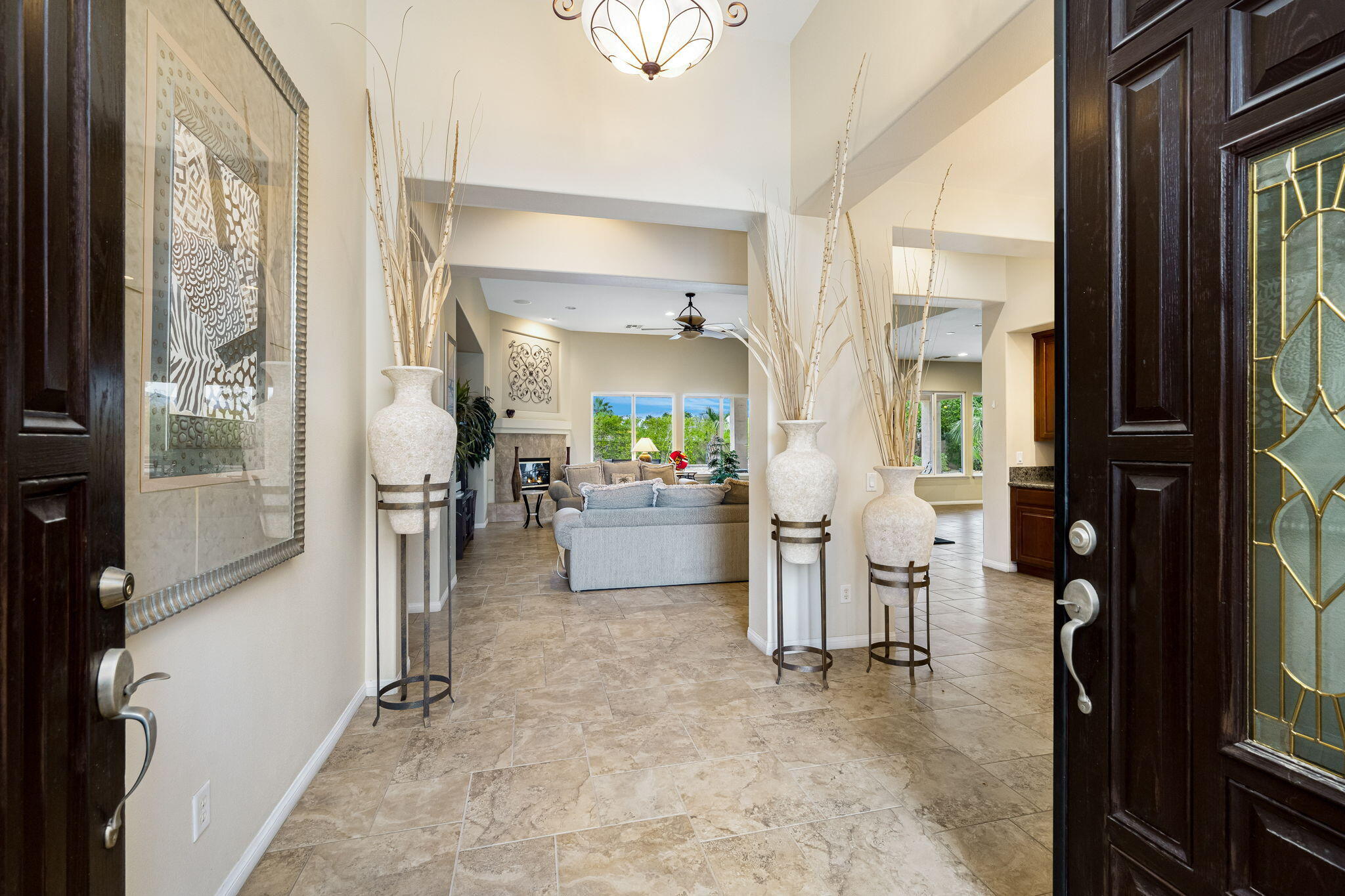 80262 Amazon Indio, CA 92201 - Photo 8 of 45 a view of a hallway with dining area and chandelier