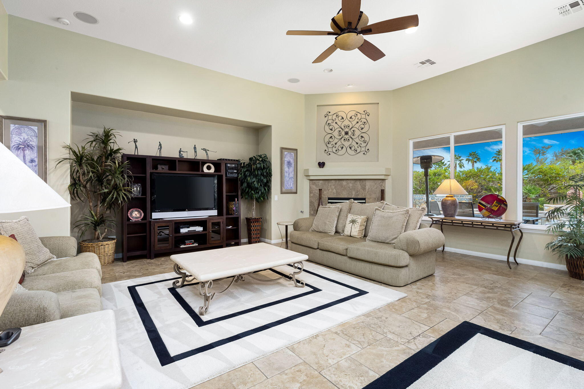 80262 Amazon Indio, CA 92201 - Photo 10 of 45 a living room with furniture flat screen tv and a large window