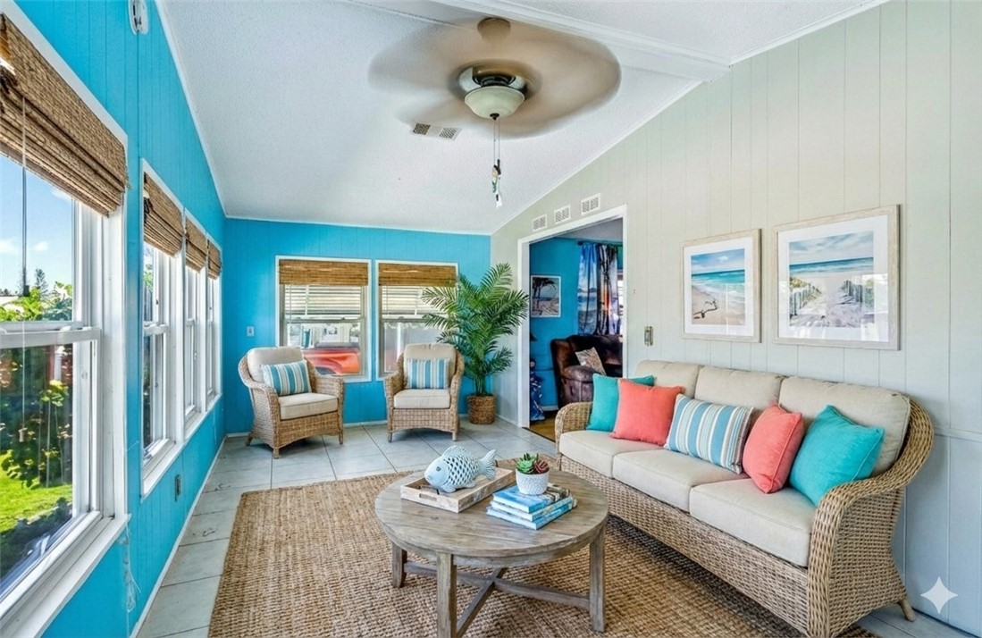 717 Wedelia Drive Sebastian, FL 32976 - Photo 11 of 24 a living room with furniture and a large window