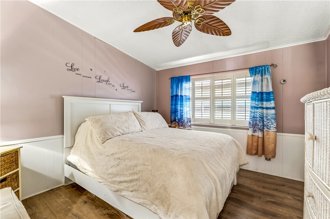 717 Wedelia Drive Sebastian, FL 32976 - Photo 15 of 24 a large bed sitting in a bedroom next to a window