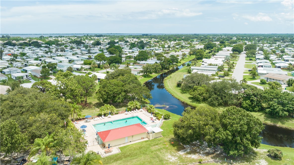 717 Wedelia Drive Sebastian, FL 32976 - Photo 18 of 24 an aerial view of residential houses with outdoor space and trees