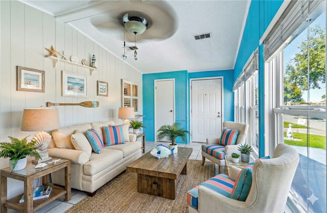 717 Wedelia Drive Sebastian, FL 32976 - Photo 4 of 24 a living room with furniture and a large window