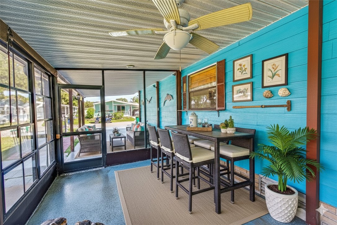 717 Wedelia Drive Sebastian, FL 32976 - Photo 5 of 24 a dining room with furniture wooden floor and a potted plant