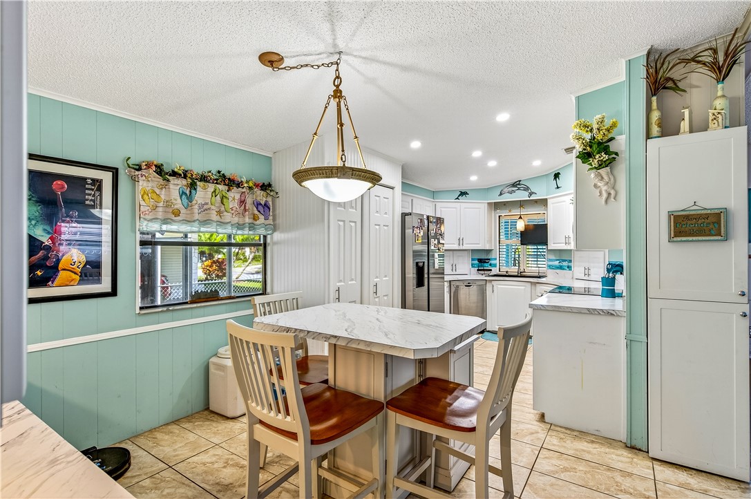 717 Wedelia Drive Sebastian, FL 32976 - Photo 7 of 24 a dining room with furniture and window