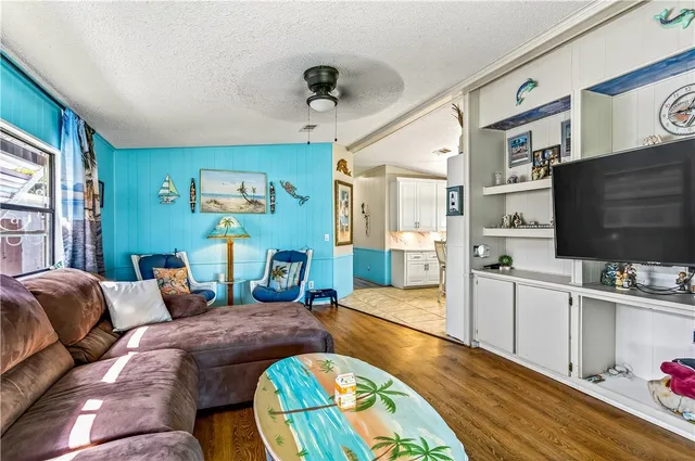 a bedroom with furniture and a flat screen tv
