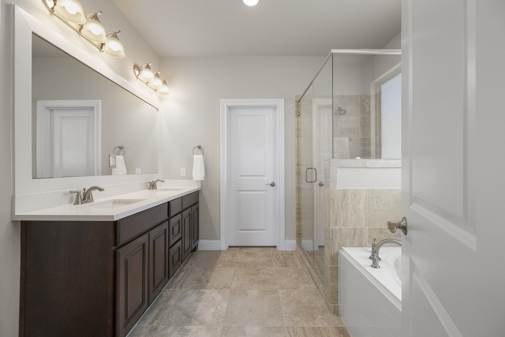 7502 Windsor Park Court Spring, TX 77379 - Photo 20 of 50 a bathroom with a tub a sink double and mirror