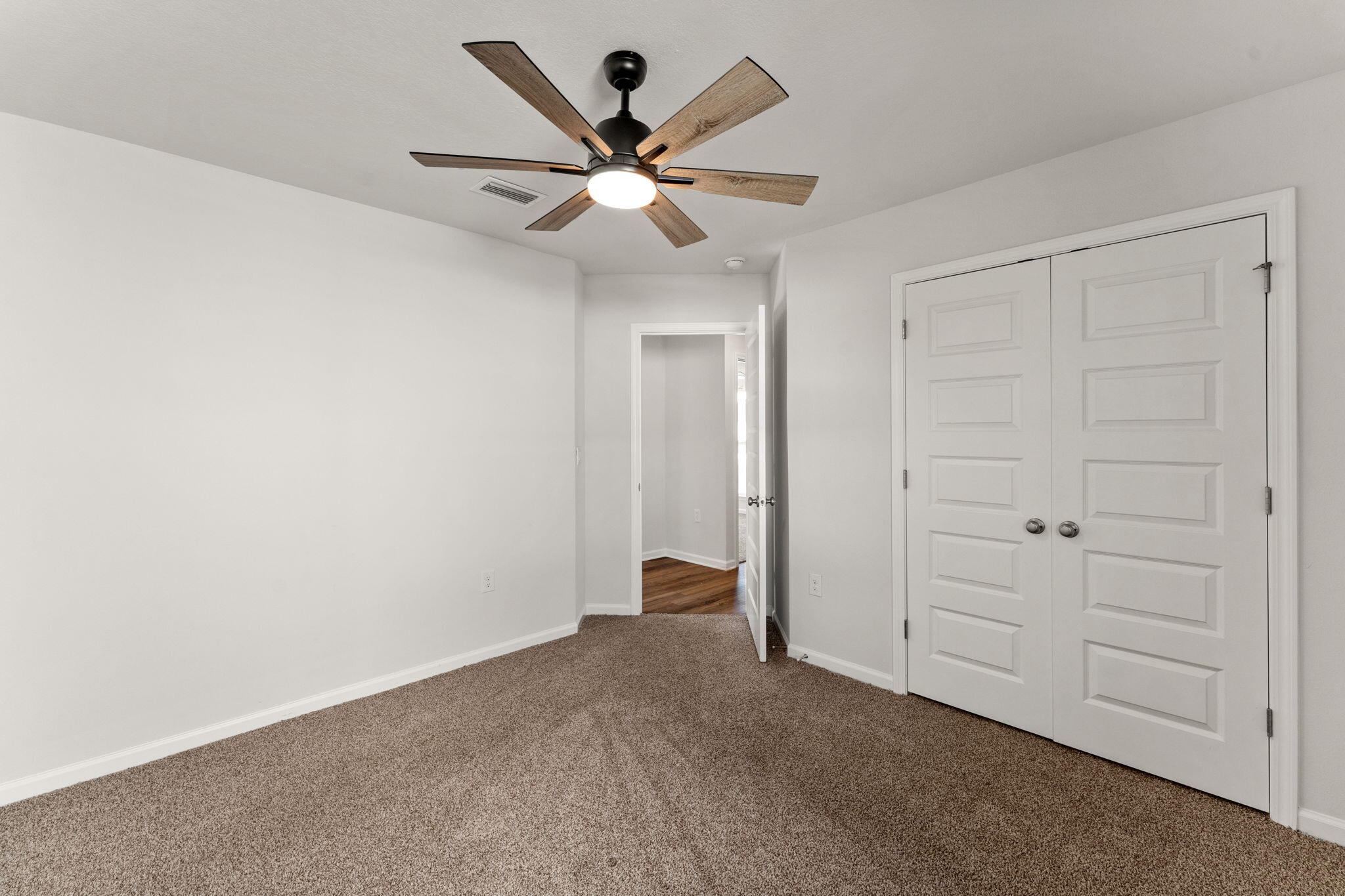 6570 Atkins Road Panama City, FL 32404 - Photo 16 of 50 wooden floor in an empty room