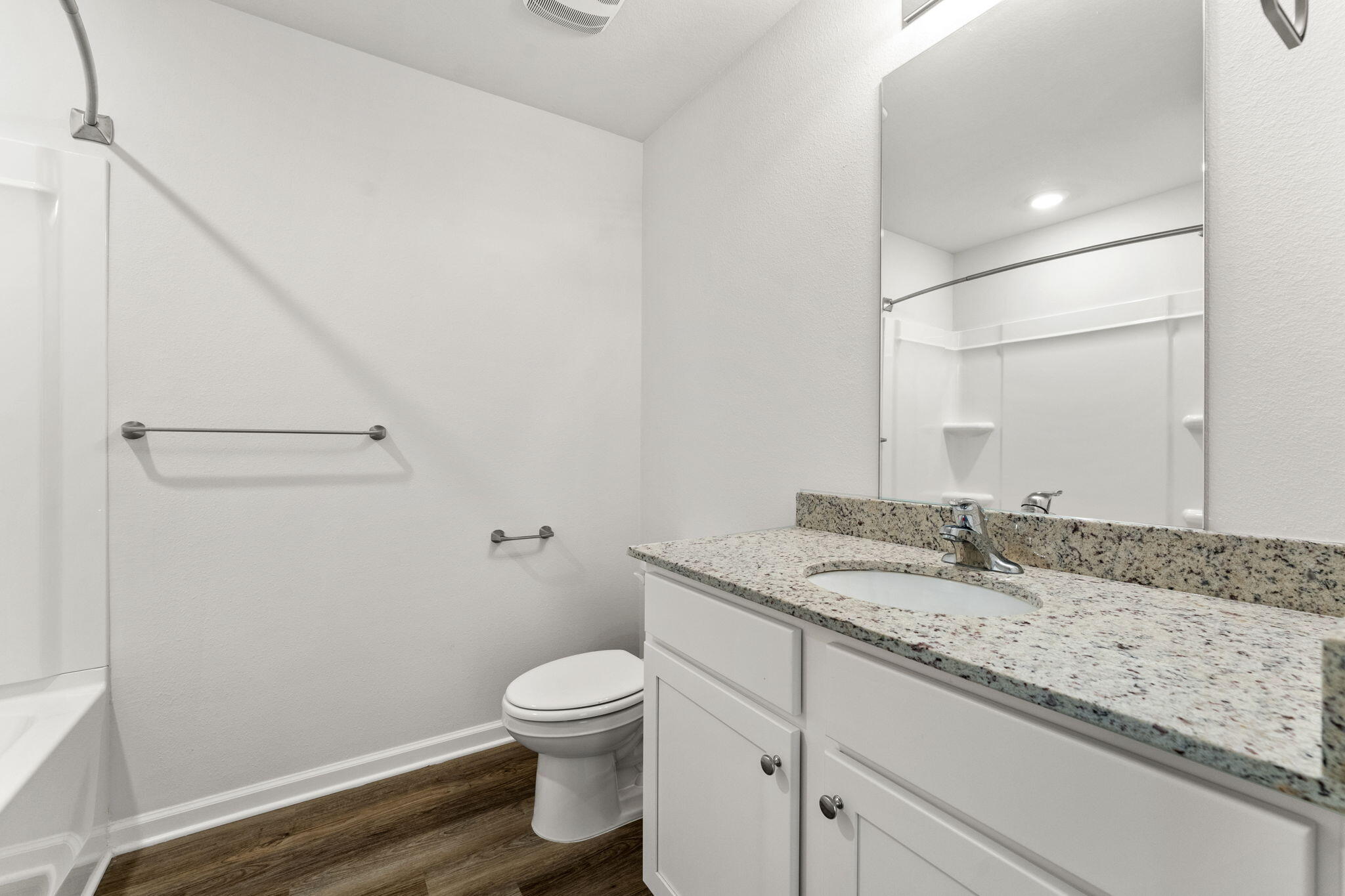 6570 Atkins Road Panama City, FL 32404 - Photo 20 of 50 a bathroom with a granite countertop sink toilet and mirror