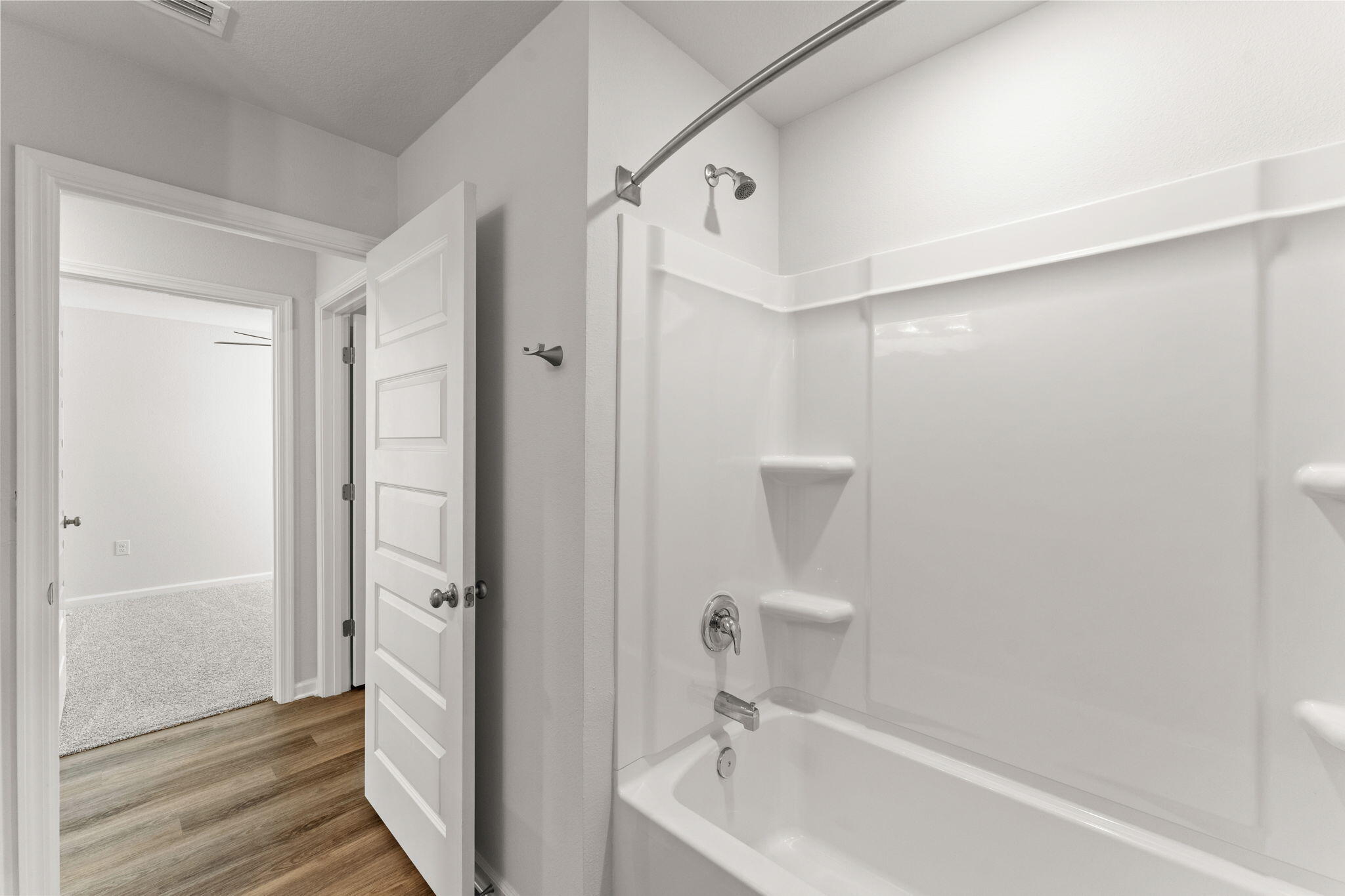 6570 Atkins Road Panama City, FL 32404 - Photo 21 of 50 a bathroom with a bathtub and a shower