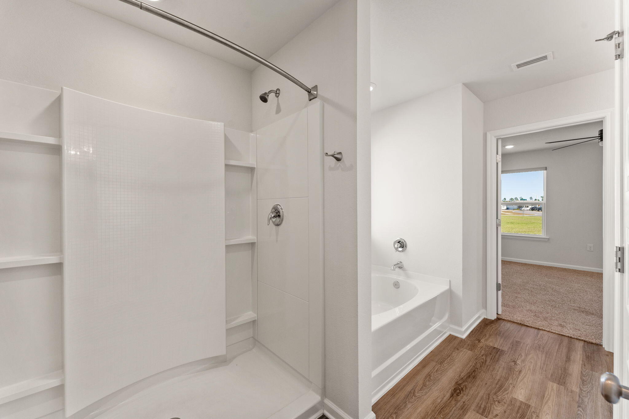 6570 Atkins Road Panama City, FL 32404 - Photo 27 of 50 a bathroom with a bathtub and shower