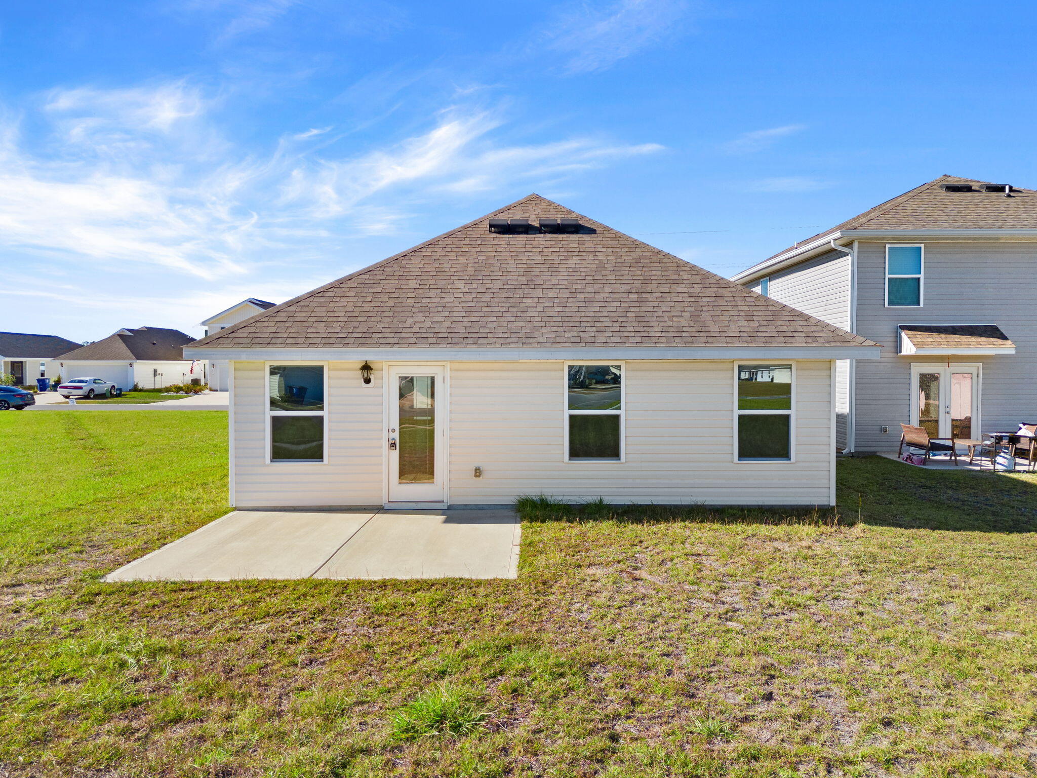 6570 Atkins Road Panama City, FL 32404 - Photo 33 of 50 a house with garden in front of it
