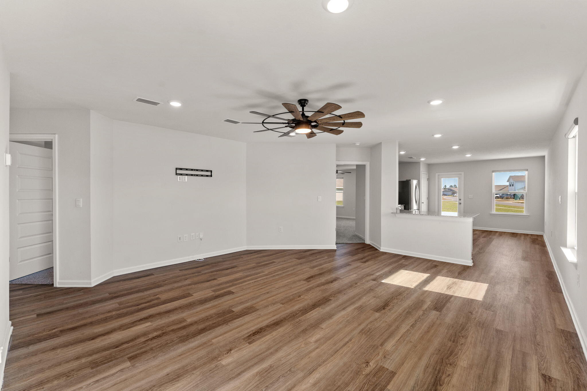 6570 Atkins Road Panama City, FL 32404 - Photo 5 of 50 a view of an empty room and wooden floor