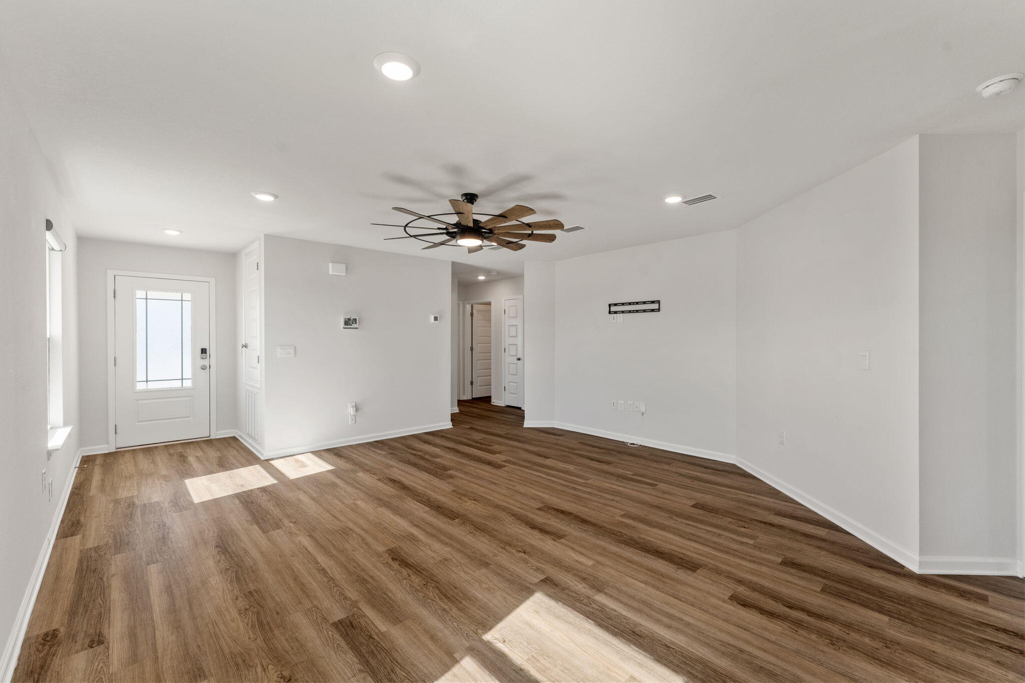 6570 Atkins Road Panama City, FL 32404 - Photo 6 of 50 a view of a livingroom with wooden floor